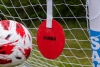 Close-up of a red SAMBA football shooting target with Velcro fastening strap, designed to improve shooting accuracy.